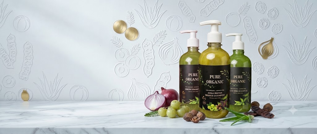 Pure Organic sulphate-free shampoo and herbal hair oil bottles with fresh botanical ingredients